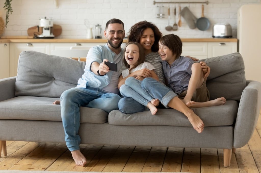 Smiling parents with little kids